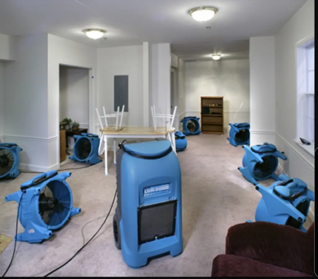 Air movers and dehumidifier setup for Water Damage Restoration in Ione